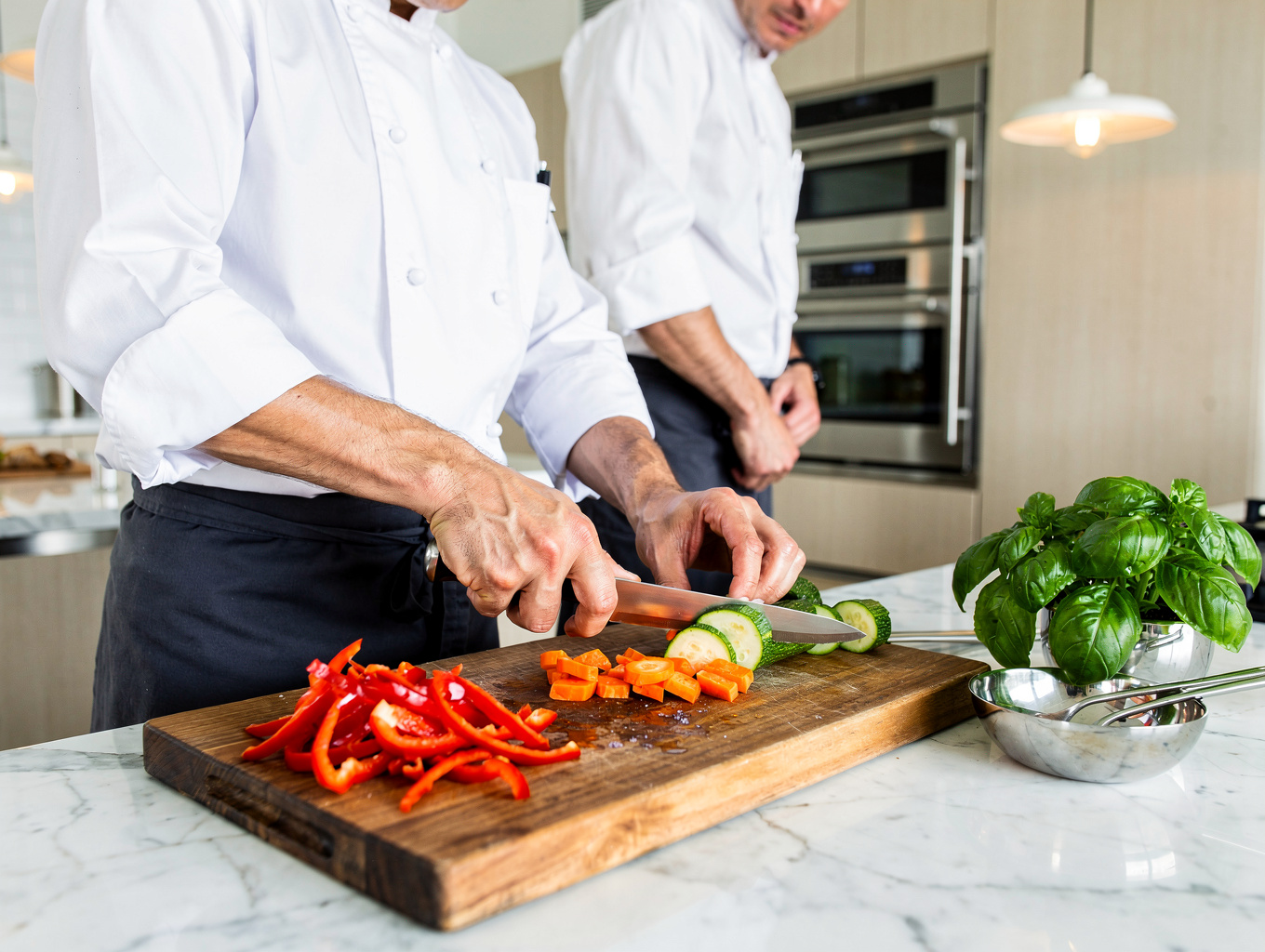Chef preparing fresh seasonal Italian ingredients in the Misto kitchen